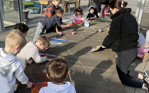 4 year old kids at kinder drawing and painting