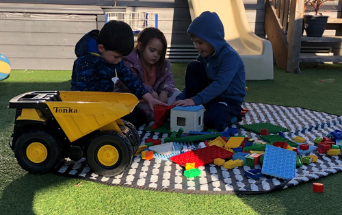 Children playing in preschool playground